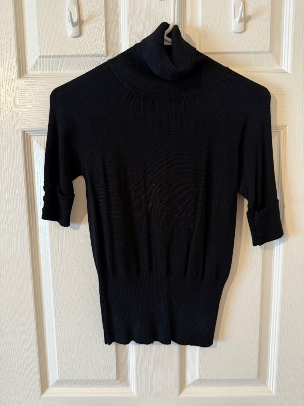 Quarter length sleeve turtleneck
